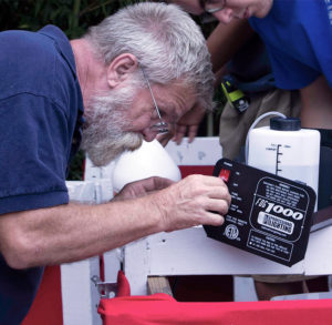 Habitat construction director Doug Carver fine-tunes the smoke machine