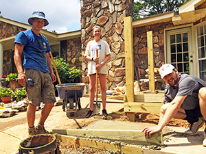 Habitat crew and volunteers install a handicap ramp for a Clarke County homeowner