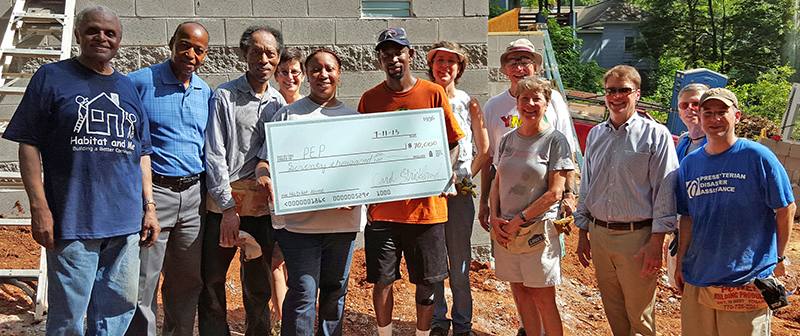 Donors and volunteers at Habitat build site