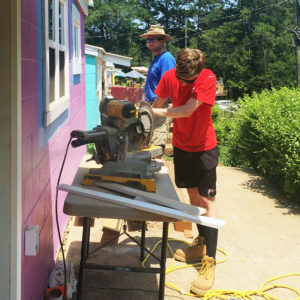 AAHFH volunteers sawing at build site