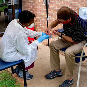 Athens Habitat executive director Spencer Frye receives a COVID-19 test