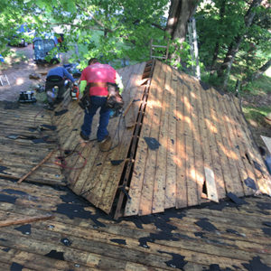 Roofers from Accent Roofing make repairs on a home in Athens, GA