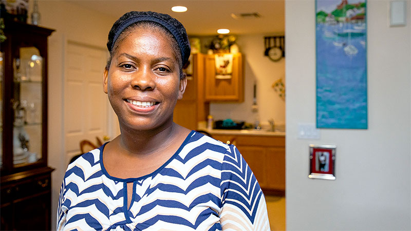 A Habitat homeowner in her living room