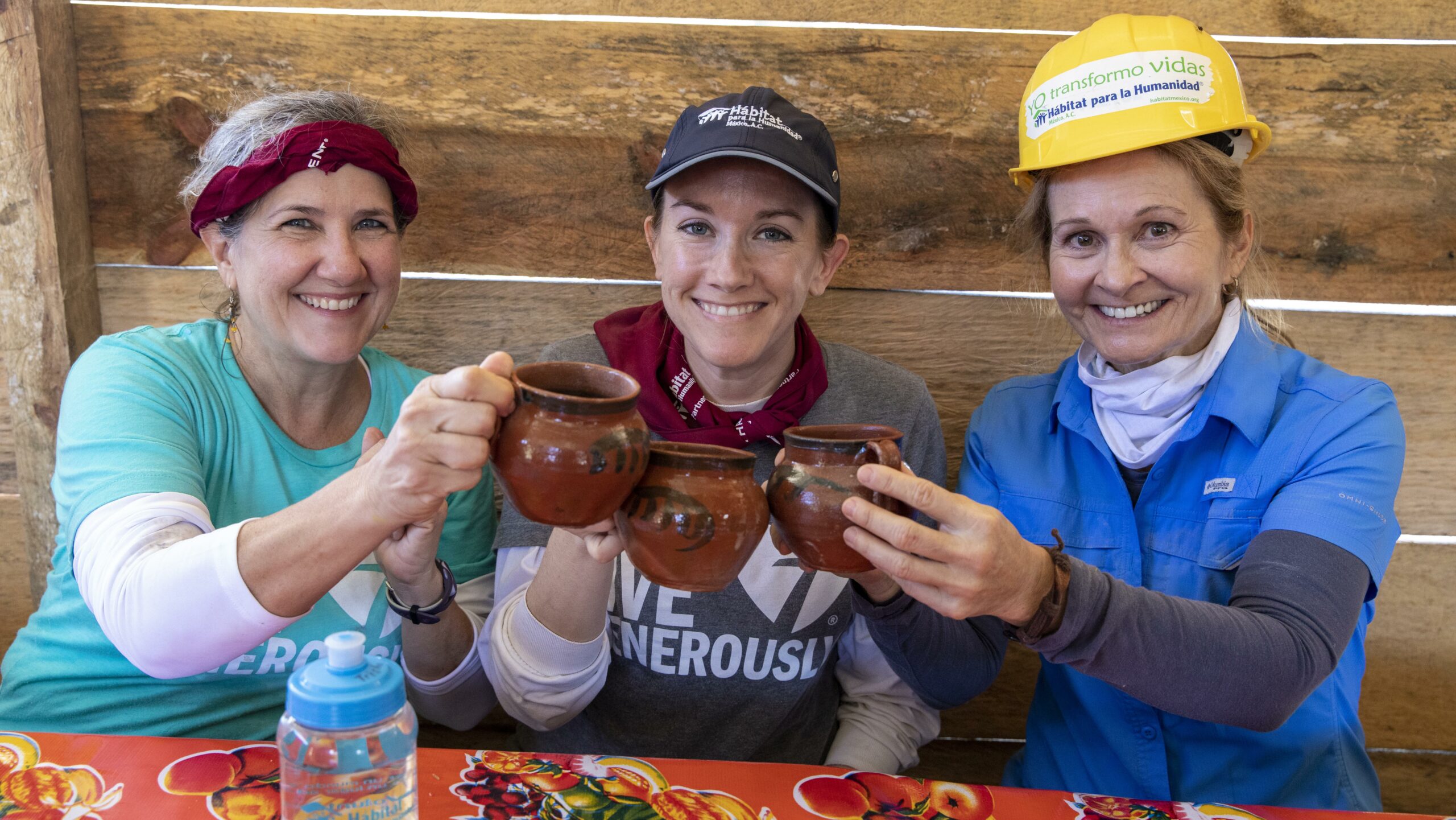 Three Habitat volunteers drinking coffee